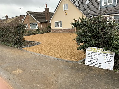 Block paving edging and pathways, finished with tarmac.